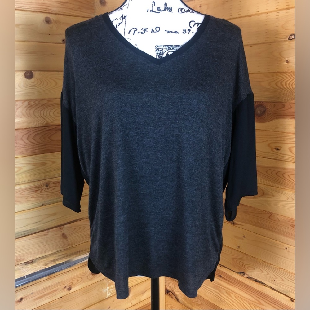 NWT black mixed media drop shoulder black top with black sheer back